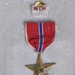 O'Brien's Bronze Star in presentation folder.