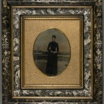 African American Woman with Painted Sea Shore. Unidentified photographer. Oil on tintype. Ca. 1875. Marbleized green Eastlake style frame.