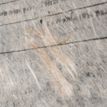 The sheets show bits of bark and small twigs worked into the fabric of the paper, and dramatic whorls of lokta fiber here and there.