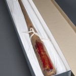 Robert De Niro used this bat as a prop in the movie "The Untouchables" (1987). The box is lined with Tyvek, a non-abrasive material meant to prevent the fake blood on the bat from sticking to any material surrounding it. Photo by Pete Smith.