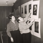 Unidentified Photographer. Helmut and Alison Gernsheim hanging an exhibition at Wayne State University, Detroit, Michigan. 1963. Gelatin silver print.