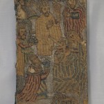 Front cover of the Bible. The photo captures the sheen of the silver thread used as background for the Adoration of the Magi scene. Silver thread is also used to depict the infant Christ's halo.