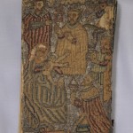 Back cover of the Bible. The back cover is almost a mirror image of the front cover. The embroidered inscription along the bottom of the back cover, however, reads "Adoraverunt" instead of "Obtulerunt."