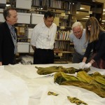 Ransom Center curators Steve Wilson (second from left) and Jill Morena (second from right) discuss construction history of the green curtain dress from ‘Gone With The Wind.’ University colleagues from Human Ecology include from left, Dr. Kay Jay, Director of the Historical Textiles and Apparel Collection; Dr. Bugao Xu, Professor in the Division of Textiles and Apparel; Dr. Sheldon Ekland-Olson, Director of the school; and Nicole Villarreal, Human Ecology graduate student. Photo by Anthony Maddaloni.