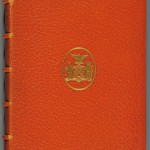 Washington Irving’s "A History of New York," Volume 1 of 2 (New York: Inskeep & Bradford, 1809). Written under the pseudonym Dietrich Knickerbocker, this playful account of New York parodies earlier histories. Owned by the New York cotton magnate M. C. D. Borden and bearing the seal of New York City on its cover, this first-edition copy was re-bound by prominent Parisian bookbinder Georges Canapé (1864–1940) close to 100 years after its printing. The bright orange color may hint at New York’s Dutch history, while the goatskin leather, commonly used by Canapé, fits the nickname that Irving gave to New York City: Gotham, or “goat town.” Photo by Pete Smith.