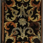 "Officium Beatae Mariae Virginis" (Venice: Paulus Balleonius, 1709). Dedicated to the Virgin Mary, this devotional is bound in thin wooden boards held together by metal hinges. The delicate fronds and flourishes on the upper and lower covers were created by inlaying various colored woods into a black veneer. Some of these woods are stained blue and green, while others retain their natural colors. The mother-of-pearl dog-roses that adorn the covers and spine are a symbol of Mary, and thus function as both ornament and clue to the book’s content. Photo by Pete Smith.
