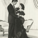 Vivien Leigh, wearing the burgundy ball gown, and her co-star Clark Gable in "Gone With The Wind."