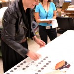 Jill Morena, collection assistant for costumes and personal effects, explains how each weight is documented with its original location on the dress.