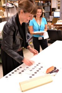 Jill Morena, collection assistant for costumes and personal effects, explains how each weight is documented with its original location on the dress.