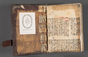 Front parchment pastedown, now detached, with offset from the manuscript visible on the boards. Both the front and rear pastedowns came from the same medieval manuscript and are now detached from the boards. Photo by Pete Smith.