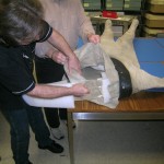 The suit is so heavy that it must be placed horizontally in order to get the hanger inside. Photo by Sonja Reid.