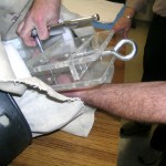 The construction of the hanger allows the center section to be removed and adjusted in order to fit the hanger inside the suit with ease and create a proper fit. Photo by Sonja Reid.