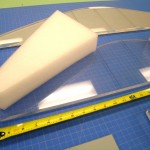 After taking measurements of the suit, the acrylic sheet panels and polyethylene foam pieces are cut to size using a pattern fashioned from blue board. Photo by Wyndell Faulk.