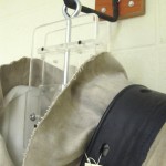 A special wall-mounted bracket is used to support the weight of the suit plus all its accoutrement, such as the weight belt when used in exhibitions. Photo by Wyndell Faulk.