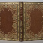 Cover of Oliver Goldsmith’s “The Hermit.” The text is Alberto Sangorski’s calligraphy on parchment, with decorative borders and illuminated miniatures. Photo by Pete Smith.