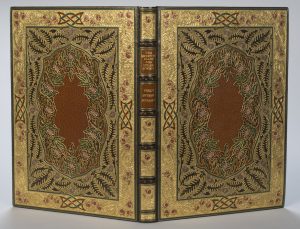 Cover of Percy Shelley’s poem “The Sensitive Plant” bound by Sangorski & Sutcliffe. The text is handwritten on parchment by Alberto Sangorski, with decorative borders and illuminated miniatures. Photo by Pete Smith.