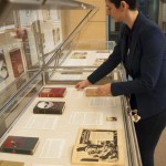 "The Intertextual Sherlock Holmes," curated by graduate intern Arcadia Falcone (shown here), is now on view outside the Reading Room. This display of rare books and periodicals features Sherlock Holmes pastiches, parodies, and fanfictions from 1895 to 1975, including works by Mark Twain, O. Henry, and John Lennon. Photo by Pete Smith.
