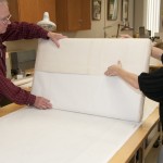 Stroud and Hamilton wrap the print around the custom pad. Photo by Pete Smith.