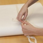 Hamilton secures the map, which is now ready for storage in its custom archival box. Photo by Pete Smith.