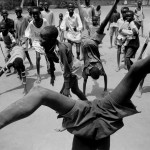 Eli Reed. "Boys playing in the camp," Kakuma Refugee Camp, Kenya. August 2001, printed 2013. August 2001, printed 2013. Inkjet print. © Eli Reed/Magnum Photos.