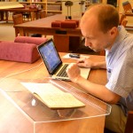 Dariusz Pachocki studies the Lesiman papers in the Ransom Center's reading room. Photo by Alicia Dietrich.