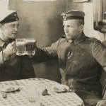 German soldiers enjoy a brief respite from trench duty in a film still from “All Quiet on the Western Front.”