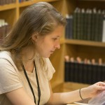 Jane Robbins Mize works with materials in the Anne Sexton collection. Photo by Pete Smith.