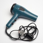 Jordon Crane's board book "Keep Our Secrets" includes this tip: "For best results read this book with a hairdryer." This hairdryer came with the archive. Photo by Pete Smith.