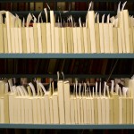 Shelves of Armed Services Editions wrapped in protective "tuxedo boxes." Photo by Alicia Dietrich.