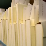 Shelves of Armed Services Editions wrapped in protective "tuxedo boxes." Photo by Alicia Dietrich.
