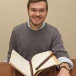 Kenneth Williams working with archive materials.