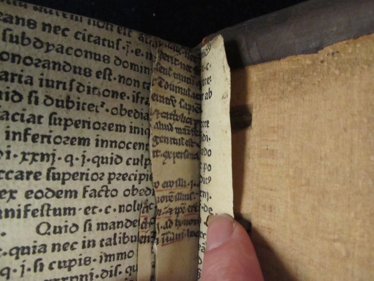 ‘The golden boke of Marcus Aurelius’ by Antonio de Guevara, London, 1546. One image shows the title-page with the facing page made up of printed binders’s waste, complete with hand-written annotations. The close-up image shows both printed and manuscript binders waste.