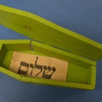 Paper found underneath sugar, with Yiddish word shalom. Photo by Pete Smith.