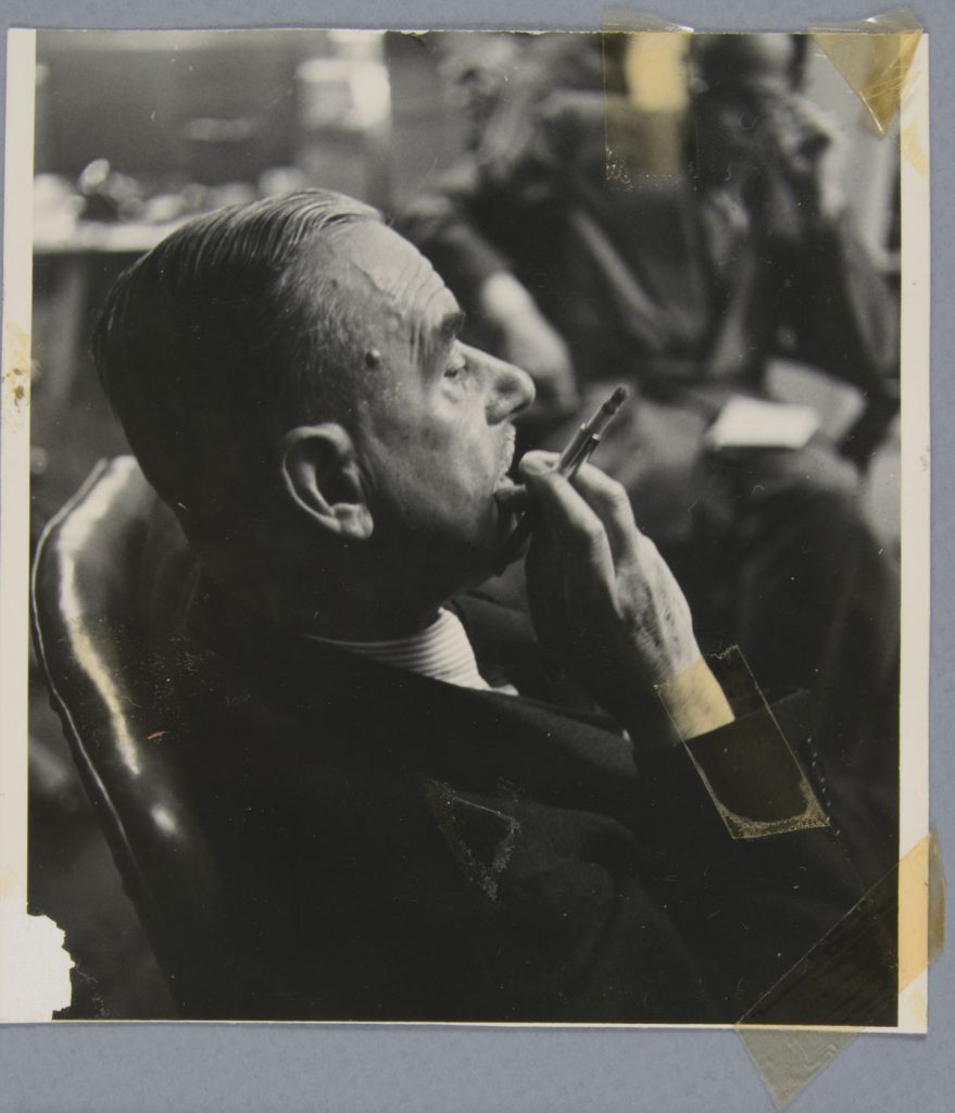 Before treatment—Front with tape residues. Elliott Erwitt (American, b. France 1928), New York, New York [Thomas Mann], 1950. Gelatin silver print, 13.5 x 12.5 cm. Alfred A. Knopf, Inc. Records, Harry Ransom Center. © Elliott Erwitt / Magnum Photos