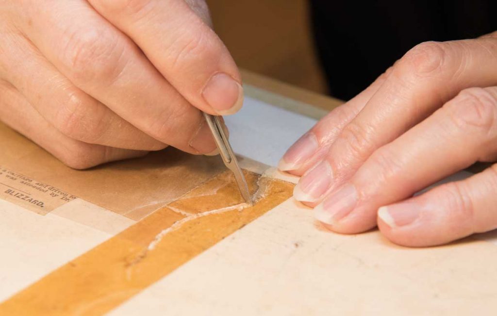 Jane Boyd makes a repair