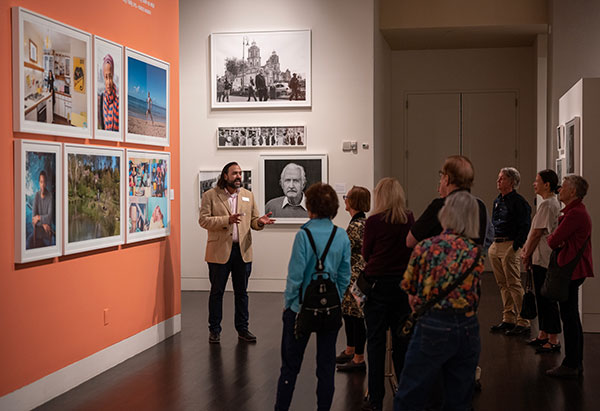 Monte Monreal guiding an exhibition tour