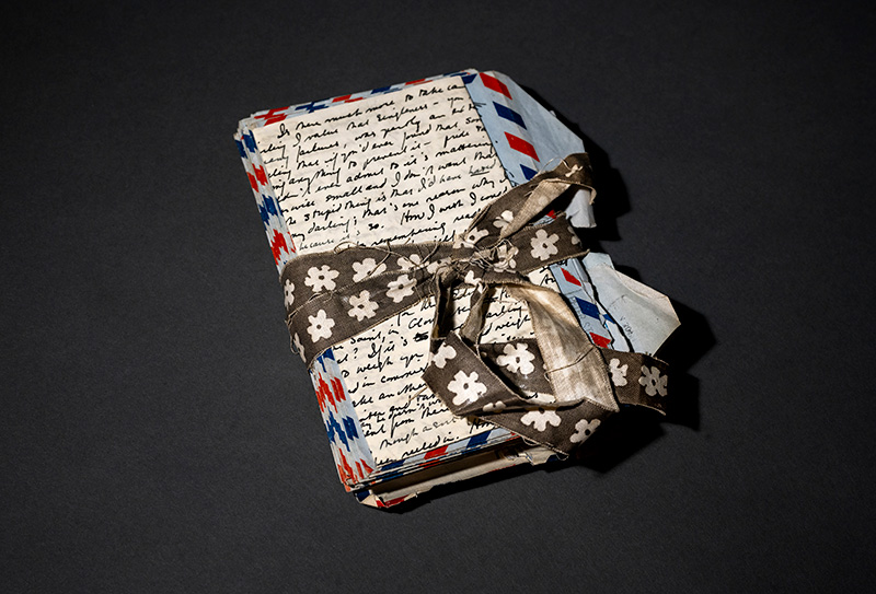 A bundle of letters tied with a ribbon