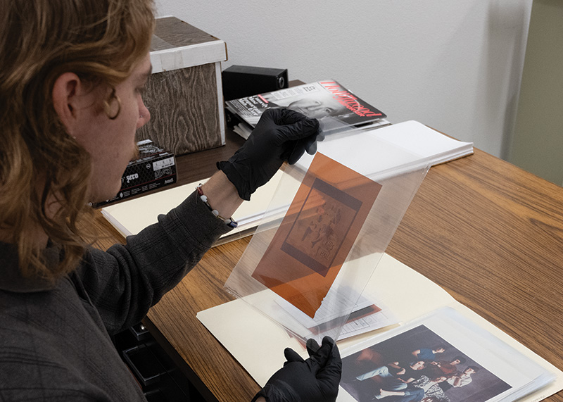 Person examining a photographic negative