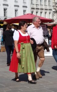 Dirndl dress and lederhosen