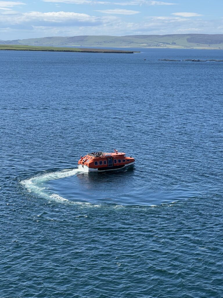 Tender doing donuts, waiting for its turn to dock (Jean Harrison)