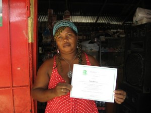 Community leader Fany Moises with her certificate of completion for participating in the capacity building course. 