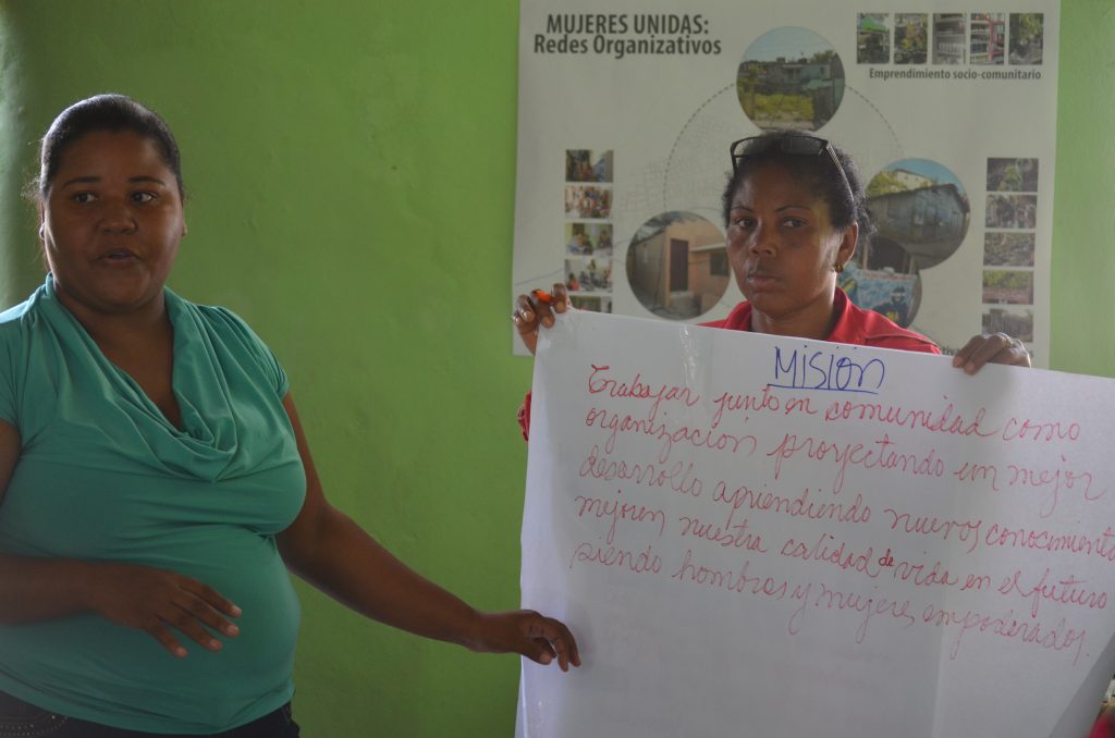 Members of Mujeres Unidas present a new mission statement they worked with project partner CIAMF to develop between the January and March trips. 