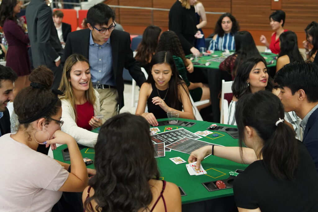 Students playing a game of poker