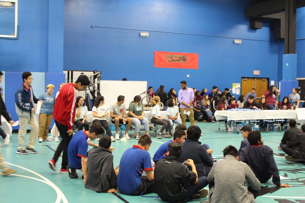 Highschool students listen keenly to Cockrell student presenters