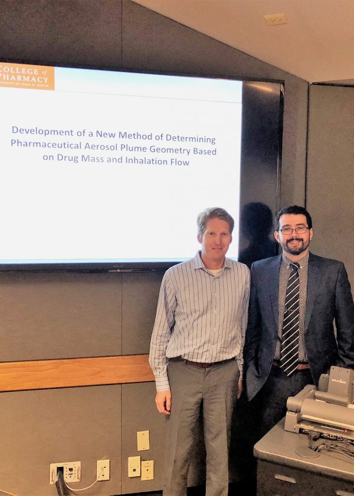 Dr. Daniel Moraga-Espinoza standing with Dr. Smyth after defending his thesis, "Development of a New Method of Determining Pharmaceutical Aerosol Plume Geometry Based on Drug Mass and Inhalation Flow."