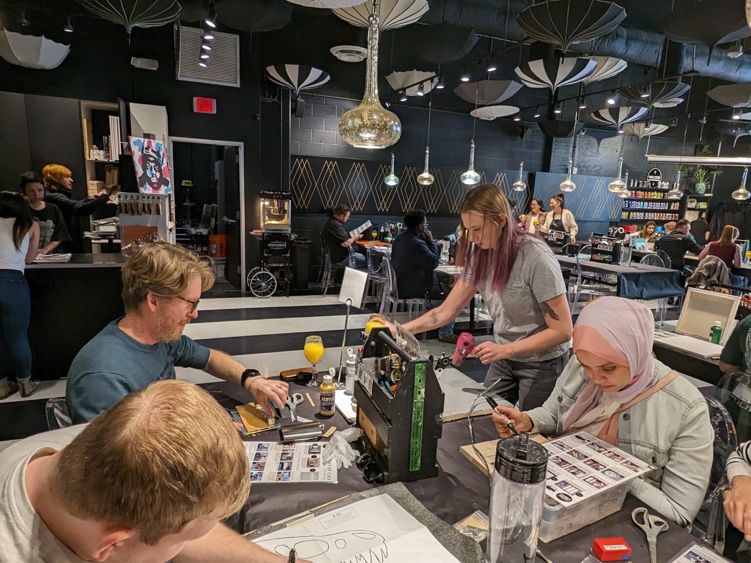 Lab members and Dr. Smyth work on art activities.