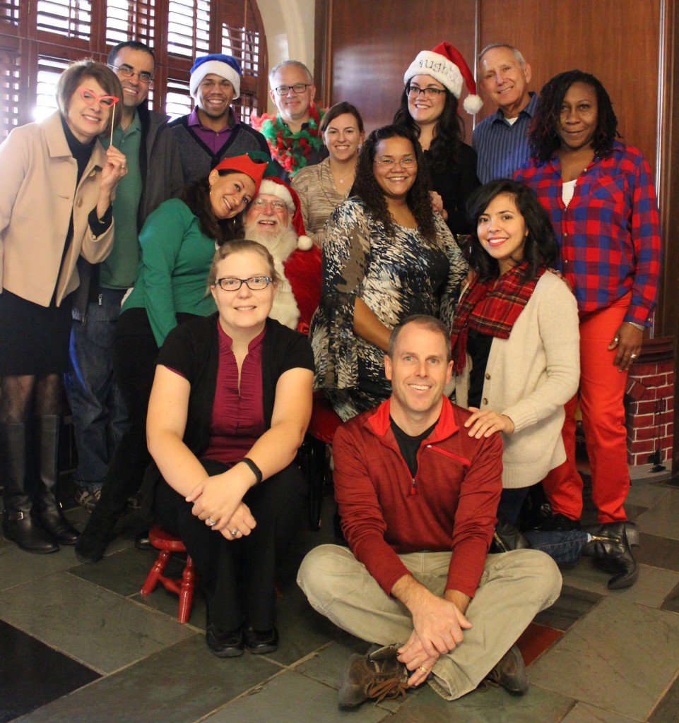 University Unions staff with Santa in the Texas Union