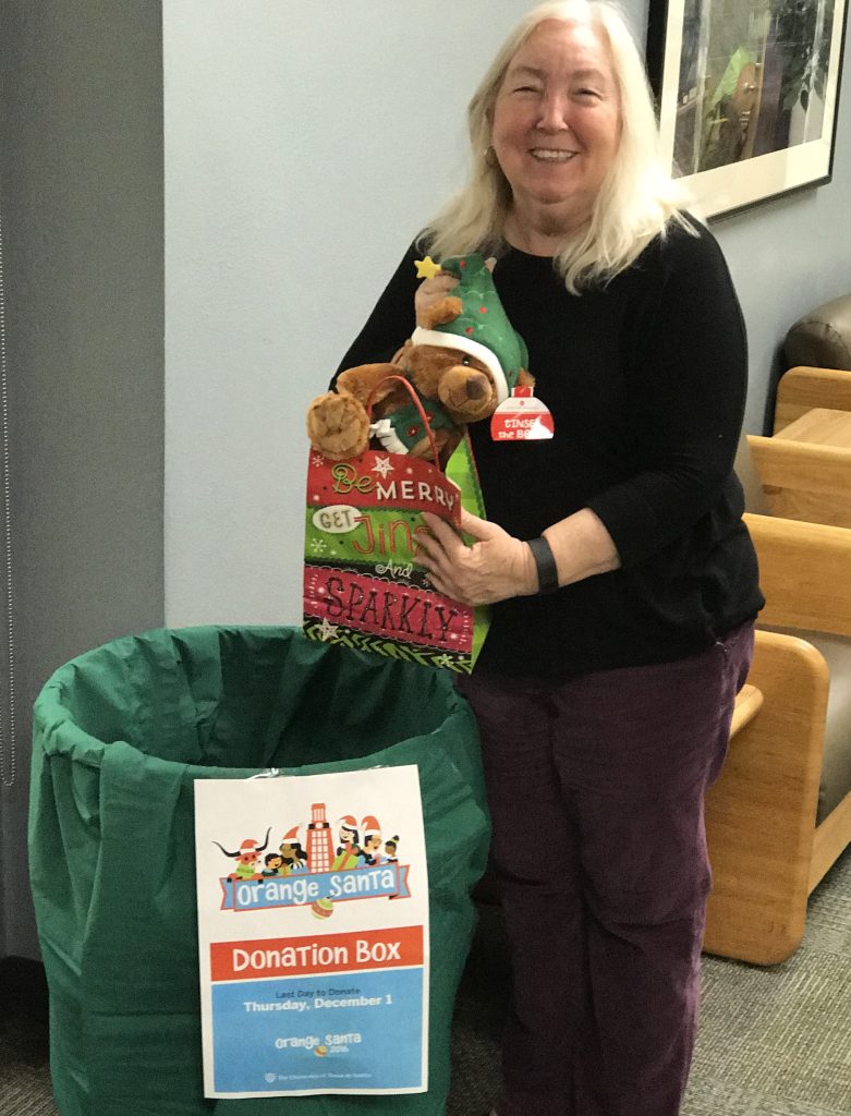 Cynthia Crawford makes a donation.