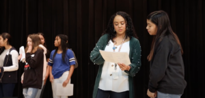 Theatre Teacher Dominique Gonzales Directing Middle School students