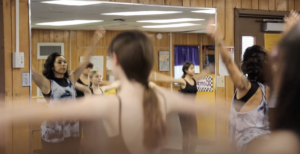 Dance Teacher Natalia Luna instructing middle school students